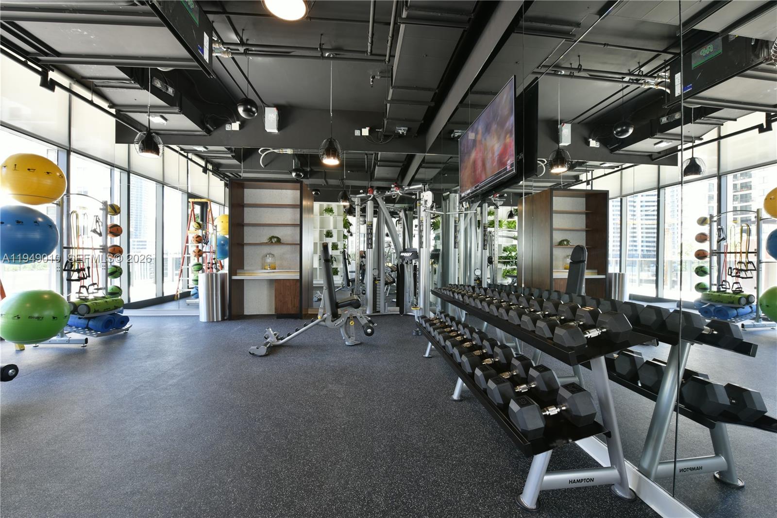 45 Southwest 9th Street, Unit 3405 Miami, FL 33130 - Photo 44 of 47 a view of a room with gym equipment