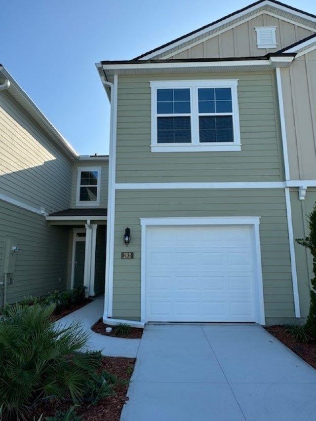 282 Redbud Road Palm Coast, FL 32137 - Photo 1 of 41 a front view of a house