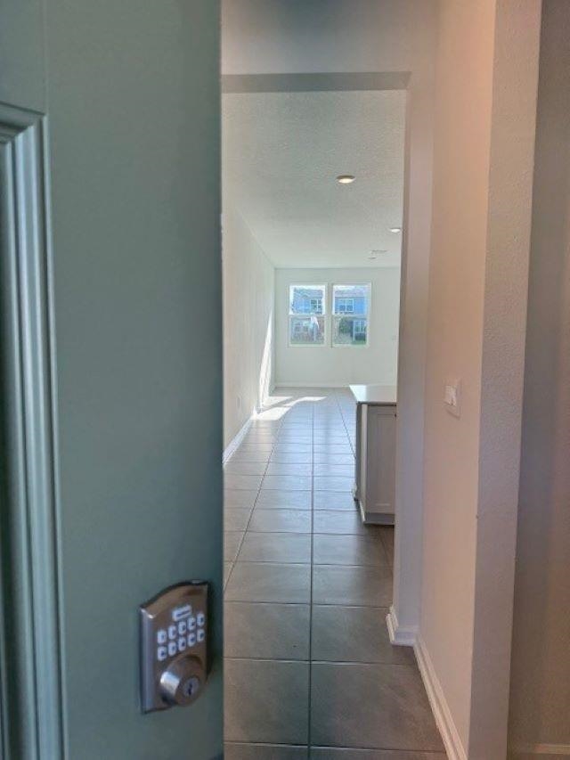 282 Redbud Road Palm Coast, FL 32137 - Photo 4 of 41 a view of a hallway with wooden floor and a bathroom