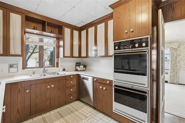 a kitchen with a sink stove and microwave