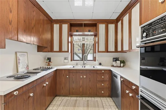 a kitchen with a refrigerator and cabinets