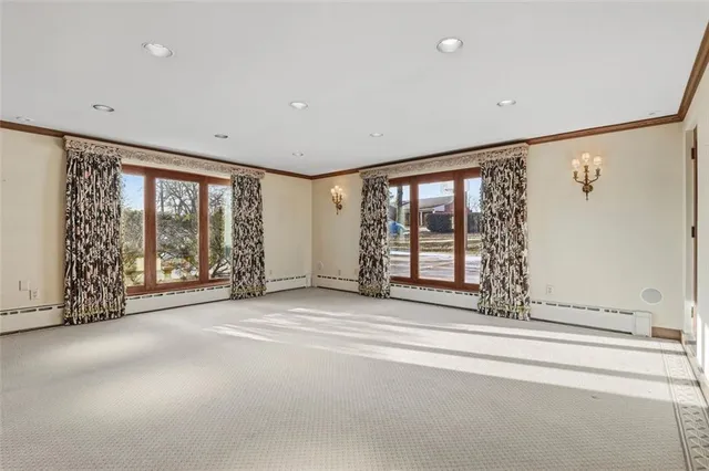 a view of livingroom with furniture wooden floor and windows