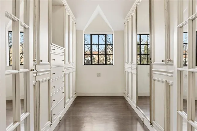 a bathroom with a shower sink and mirror