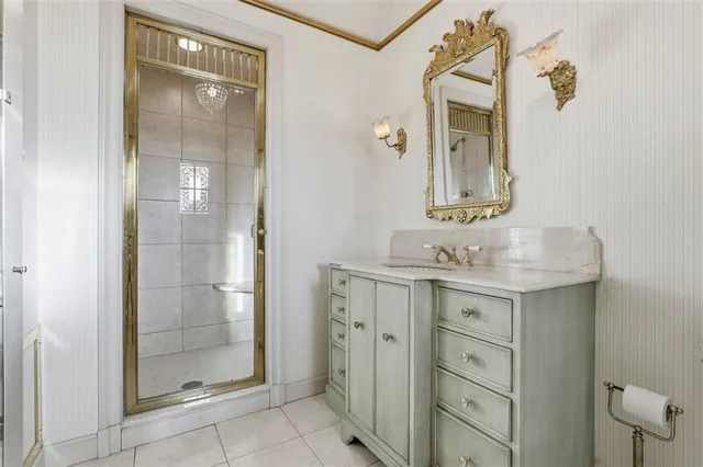 a view of an empty room with chandelier and a window