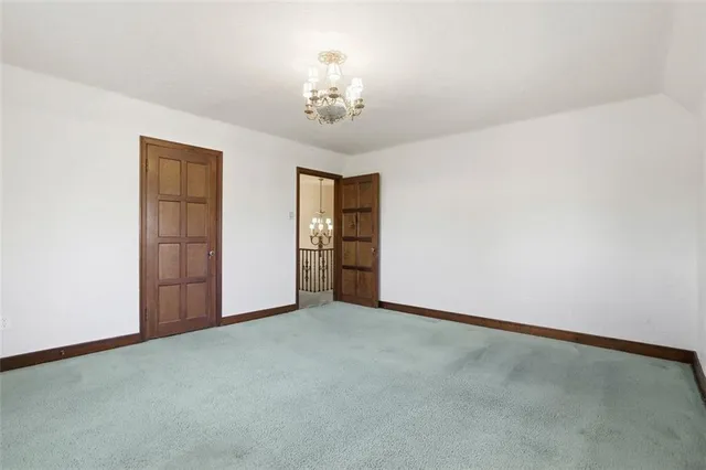 a view of an empty room with stairs