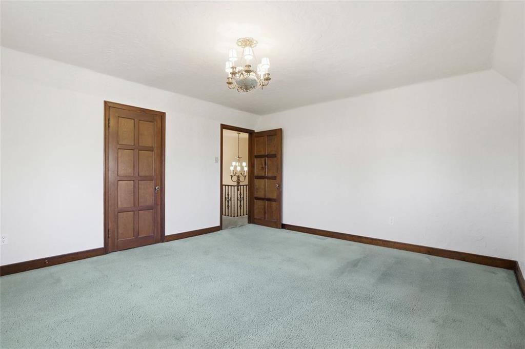 4430 Brownsville Road Pittsburgh, PA 15236 - Photo 40 of 50 a view of an empty room with chandelier and a window