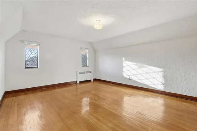 a view of a house with a yard covered in snow