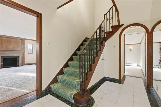 a view of entryway and hall with wooden floor