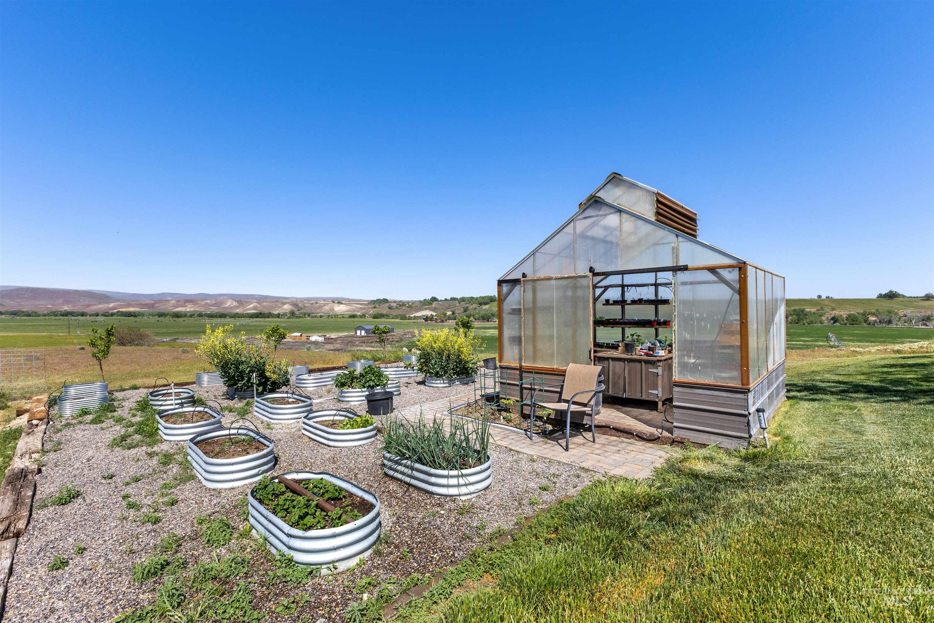 1030 Desert Glen Road Adrian, OR 97901 - Photo 21 of 47 Dedicated greenhouse structure with a clear panel roof and vented gables