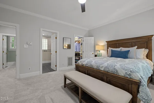 a bathroom with a granite countertop sink a mirror and a shower
