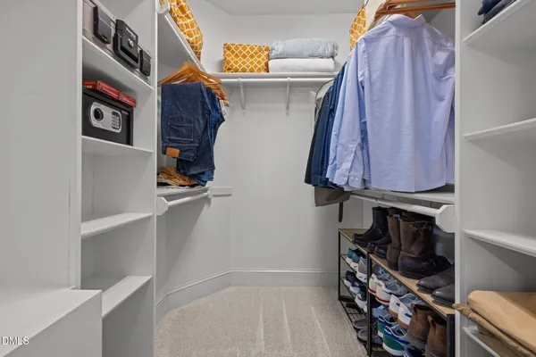 a living room with furniture and a ceiling fan