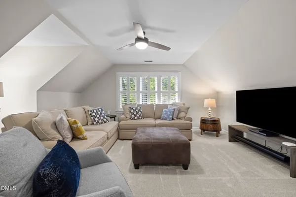 a bathroom with a granite countertop sink a large mirror and a shower