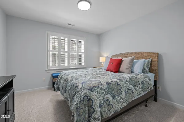 a bathroom with a sink a vanity and a large mirror