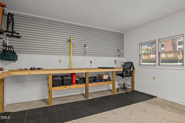 a view of a livingroom with furniture and a window