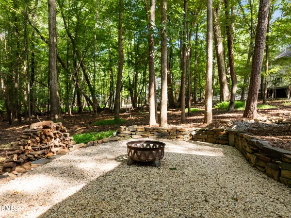 a view of balcony with wooden floor and seating space