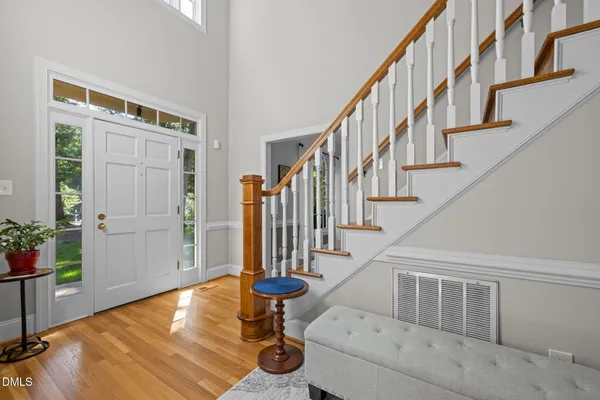 a view of a livingroom with furniture and hardwood floor