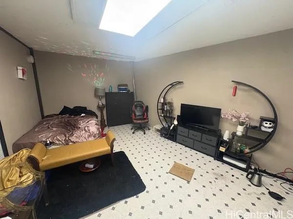 a bed room with a bed and a television