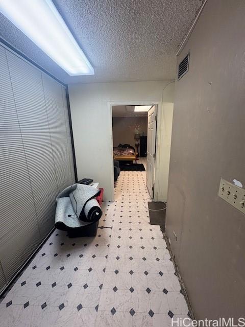 1750 Kalakaua Avenue, Unit 201 Honolulu, HI 96826 - Photo 5 of 6 a bedroom with a bed and wooden floor