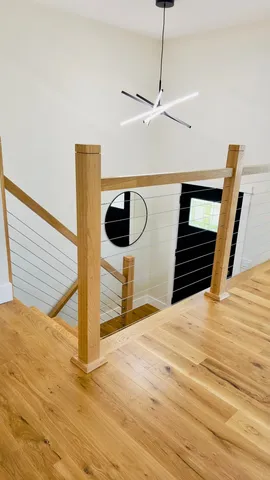 a view of a hallway with two chairs