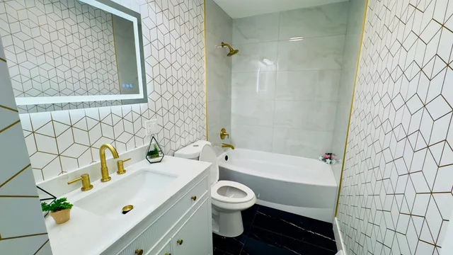 a bathroom with a sink a toilet and a bathtub