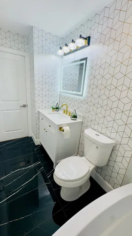 a bathroom with a toilet and a sink
