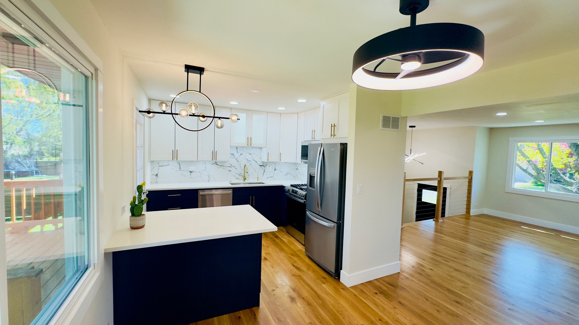 527 Northgate Road Lindenhurst, IL 60046 - Photo 7 of 35 a kitchen with stainless steel appliances a refrigerator and a wooden floor