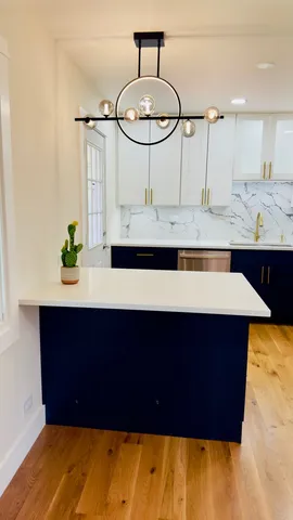a kitchen with a sink and cabinets