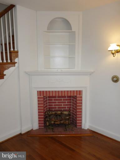 4312 Barrington Road Baltimore, MD 21229 - Photo 12 of 30 Living Room w/ Decorative Fireplace
