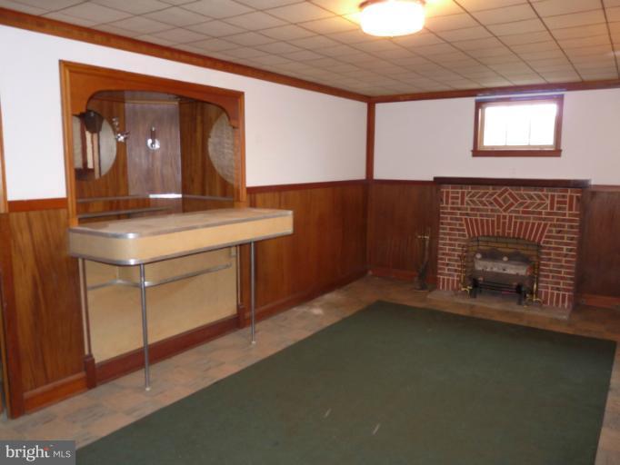 4312 Barrington Road Baltimore, MD 21229 - Photo 27 of 30 Finished Basement w/ Cozy Fireplace