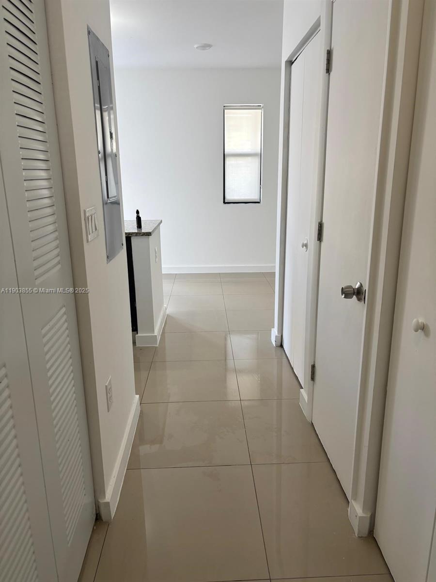 423 East 27th Street, Unit 101 Hialeah, FL 33013 - Photo 12 of 13 a view of bathroom with a sink and mirror