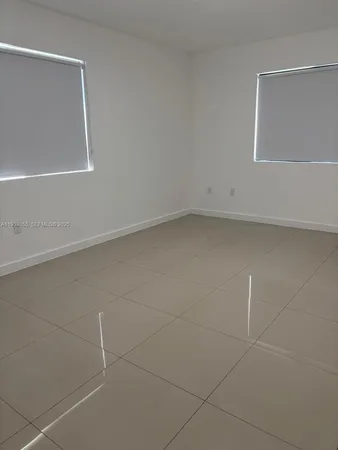 a bathroom with a toilet a sink and shower
