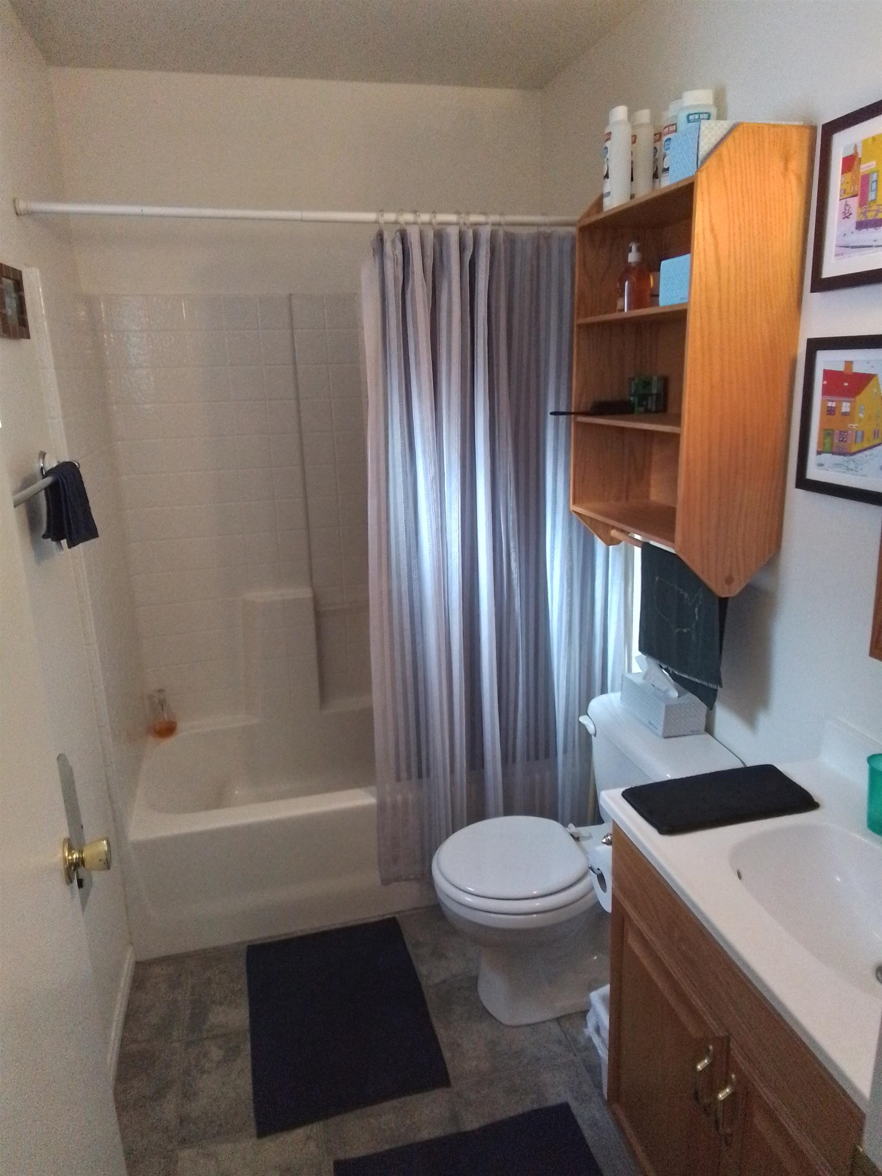 199 Hunewill Drive Bridgeport, CA 93517 - Photo 12 of 40 Bathroom featuring a white bathtub and shower surround, a white toilet, and a wood-finish vanity with an integrated sink