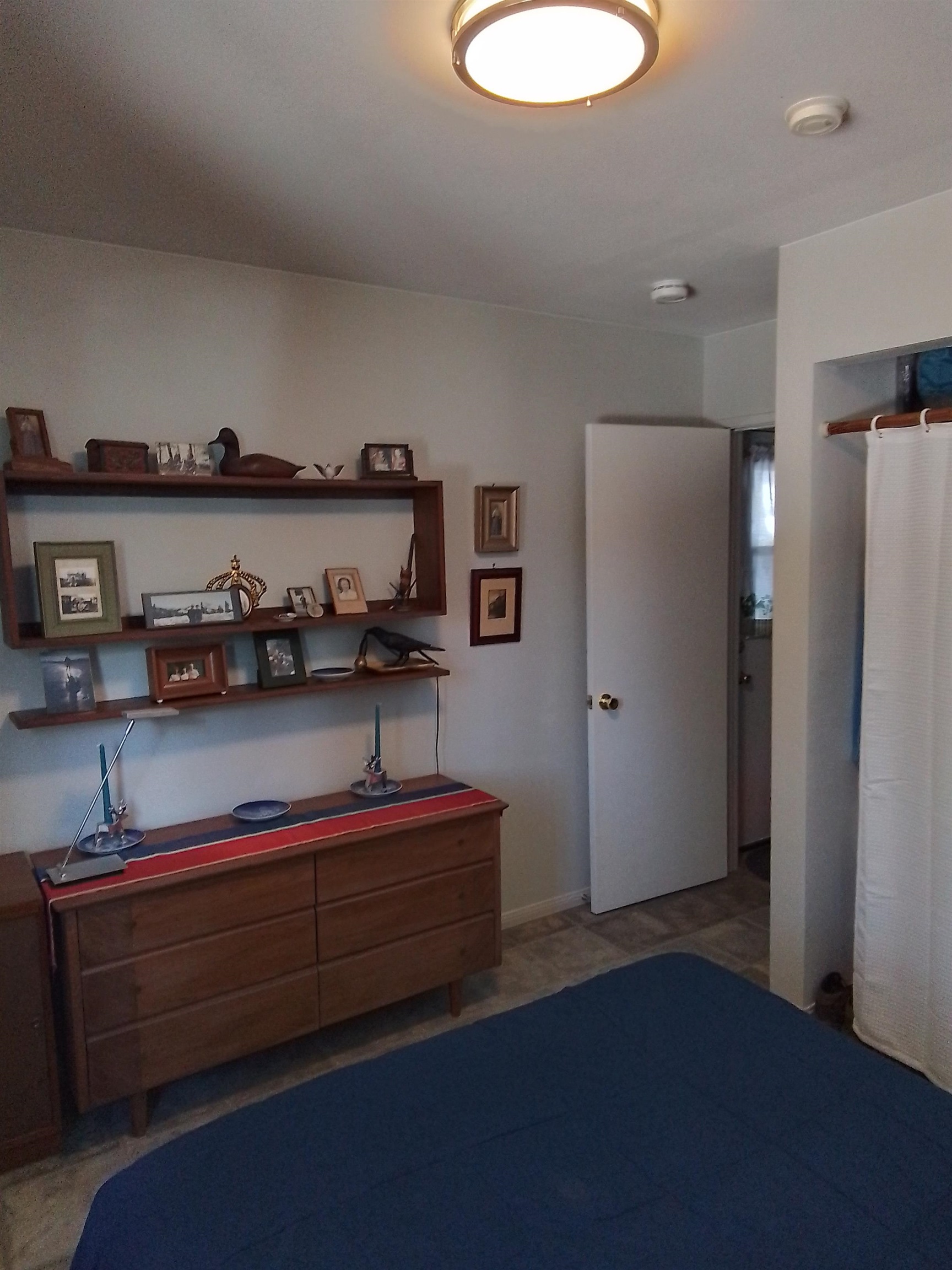 199 Hunewill Drive Bridgeport, CA 93517 - Photo 15 of 40 Hardwood shelving unit mounted above a wooden dresser featuring six drawers