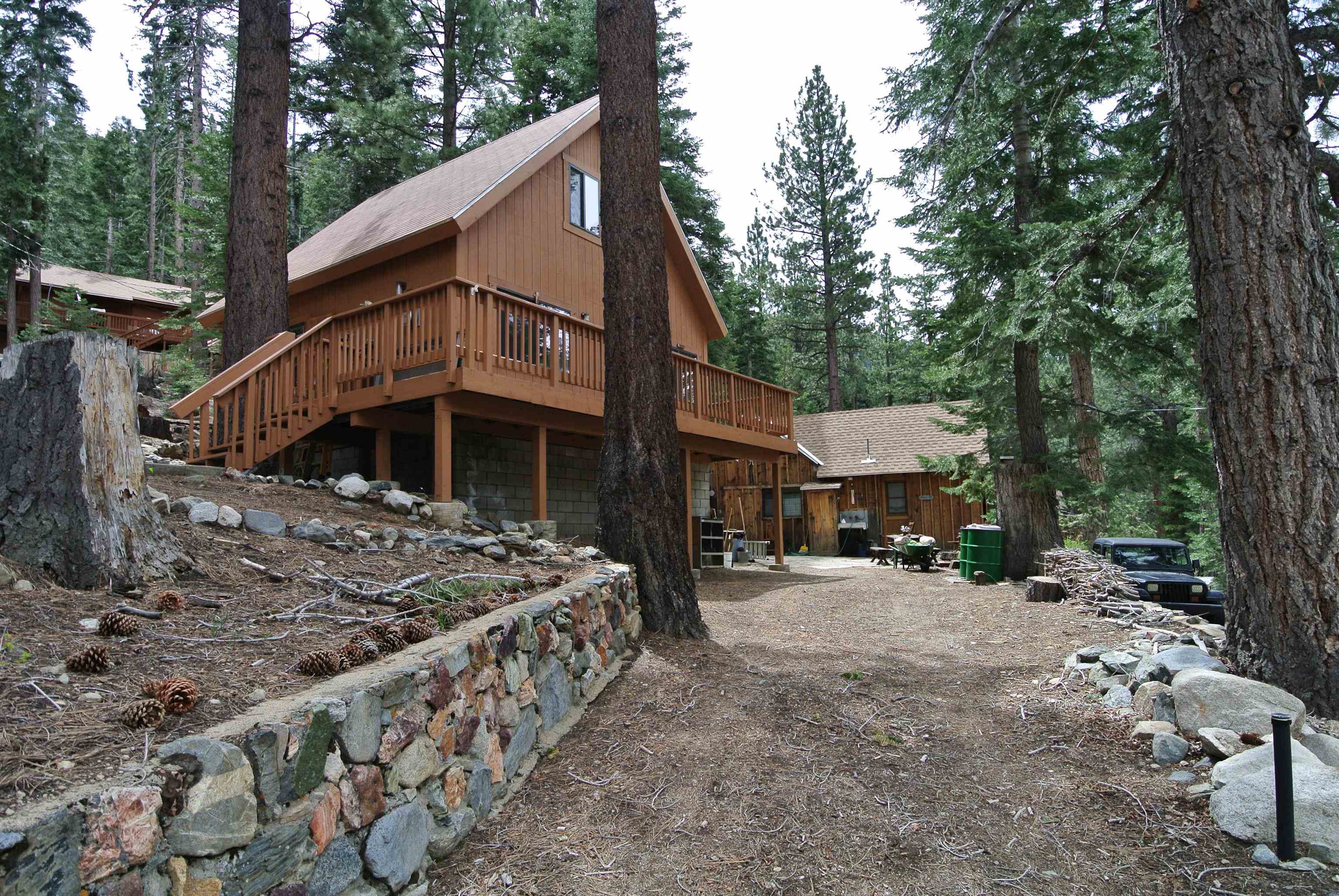 199 Hunewill Drive Bridgeport, CA 93517 - Photo 29 of 40 Wood-sided dwelling with a sloped roof and an elevated wooden deck