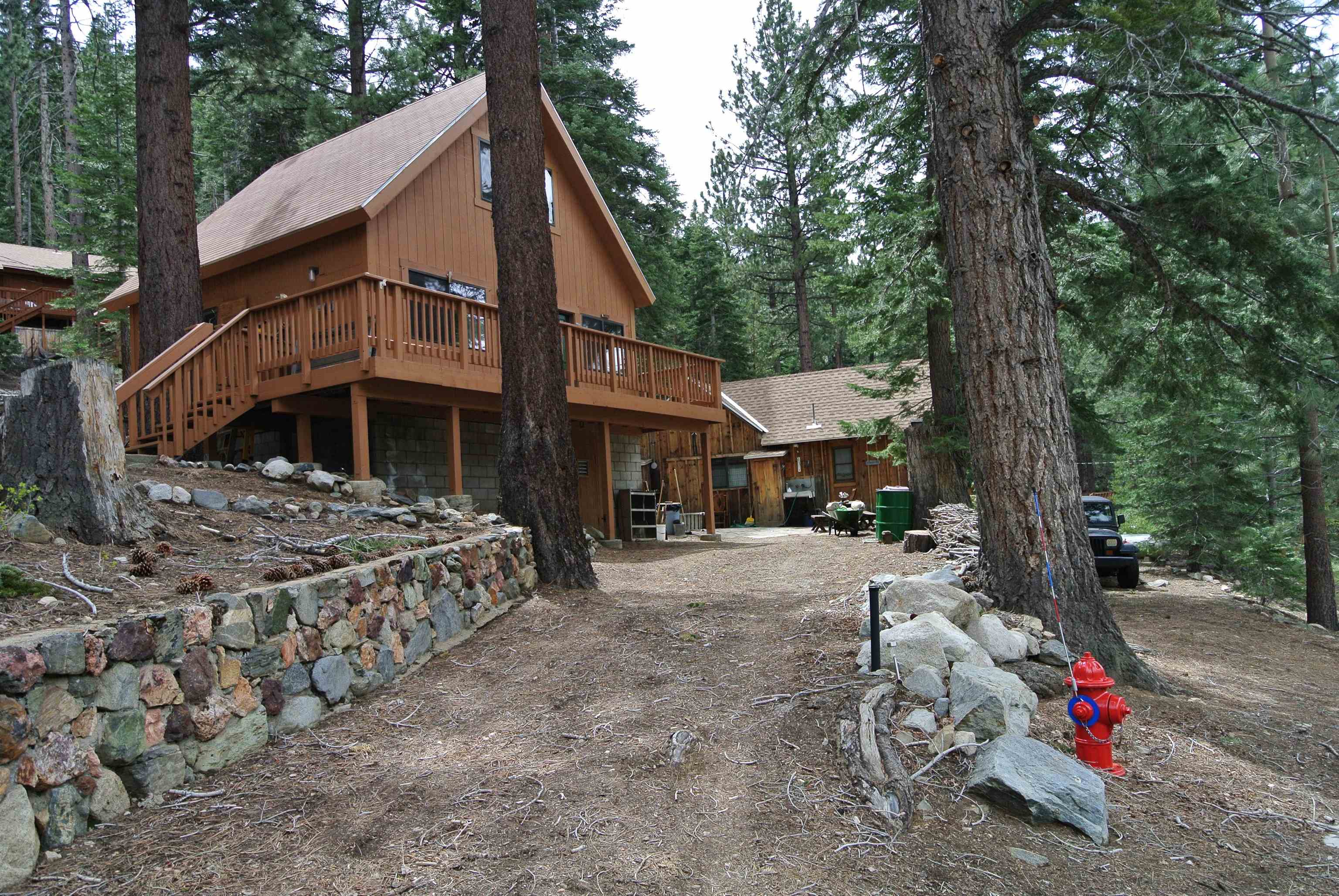 199 Hunewill Drive Bridgeport, CA 93517 - Photo 30 of 40 A-frame residence featuring a wood-sided exterior, brown shingle roof, and an expansive elevated woo