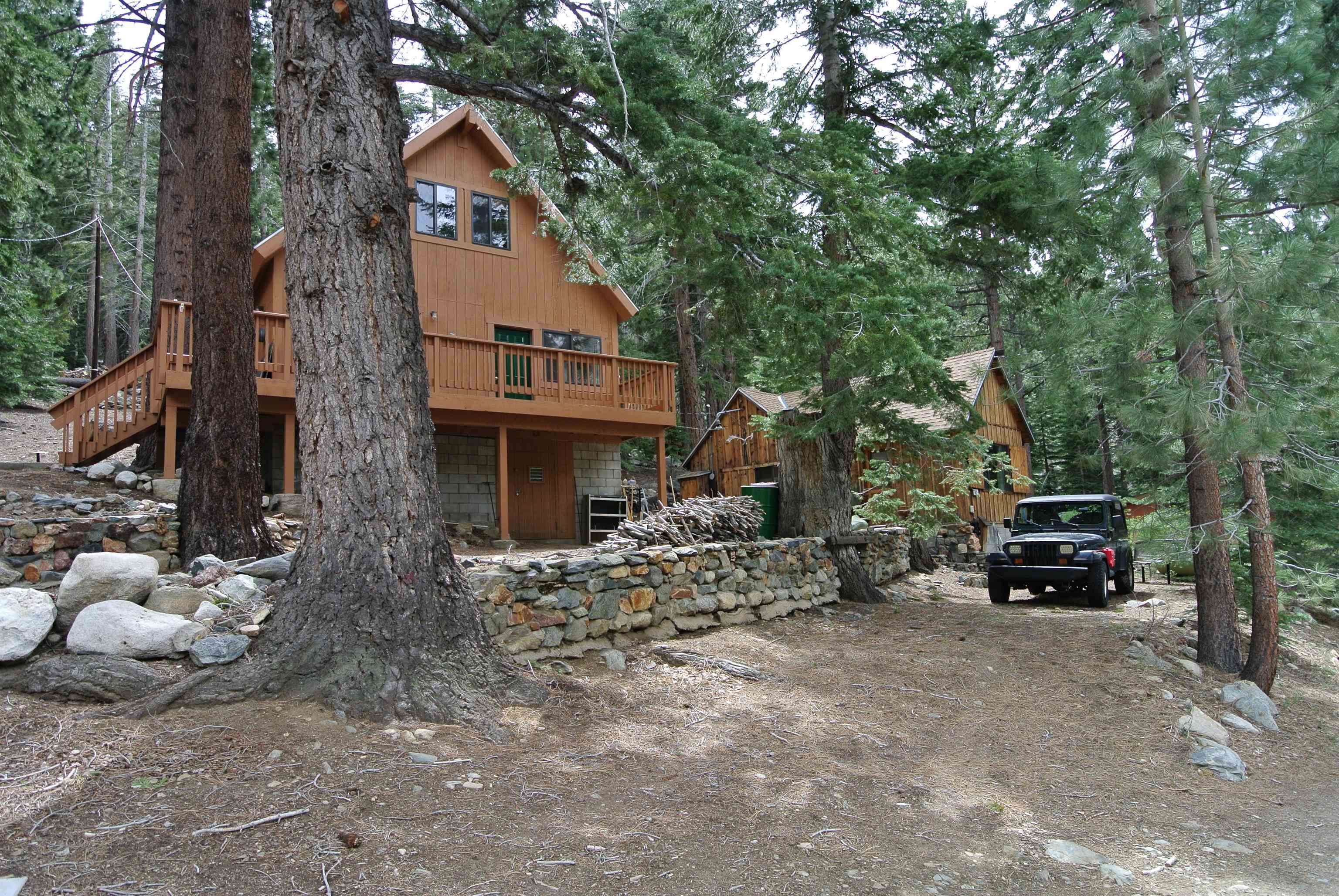 199 Hunewill Drive Bridgeport, CA 93517 - Photo 31 of 40 Wood-sided residence featuring a gabled roofline and an elevated deck with wood railings