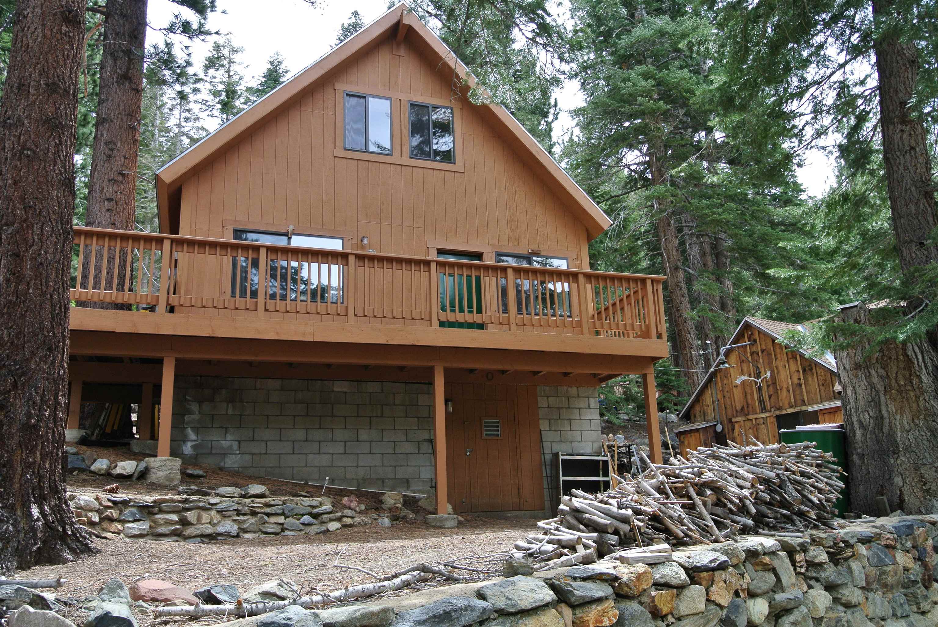 199 Hunewill Drive Bridgeport, CA 93517 - Photo 4 of 40 Wood-clad A-frame style exterior with a substantial elevated deck