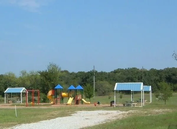 a view of swimming pool with a back yard