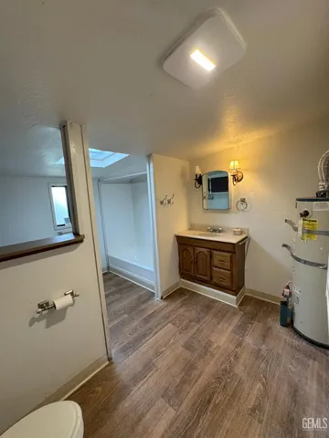 a bathroom with a double vanity sink and a toilet