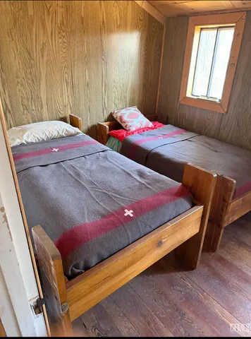 a close view of a table and chairs in backyard