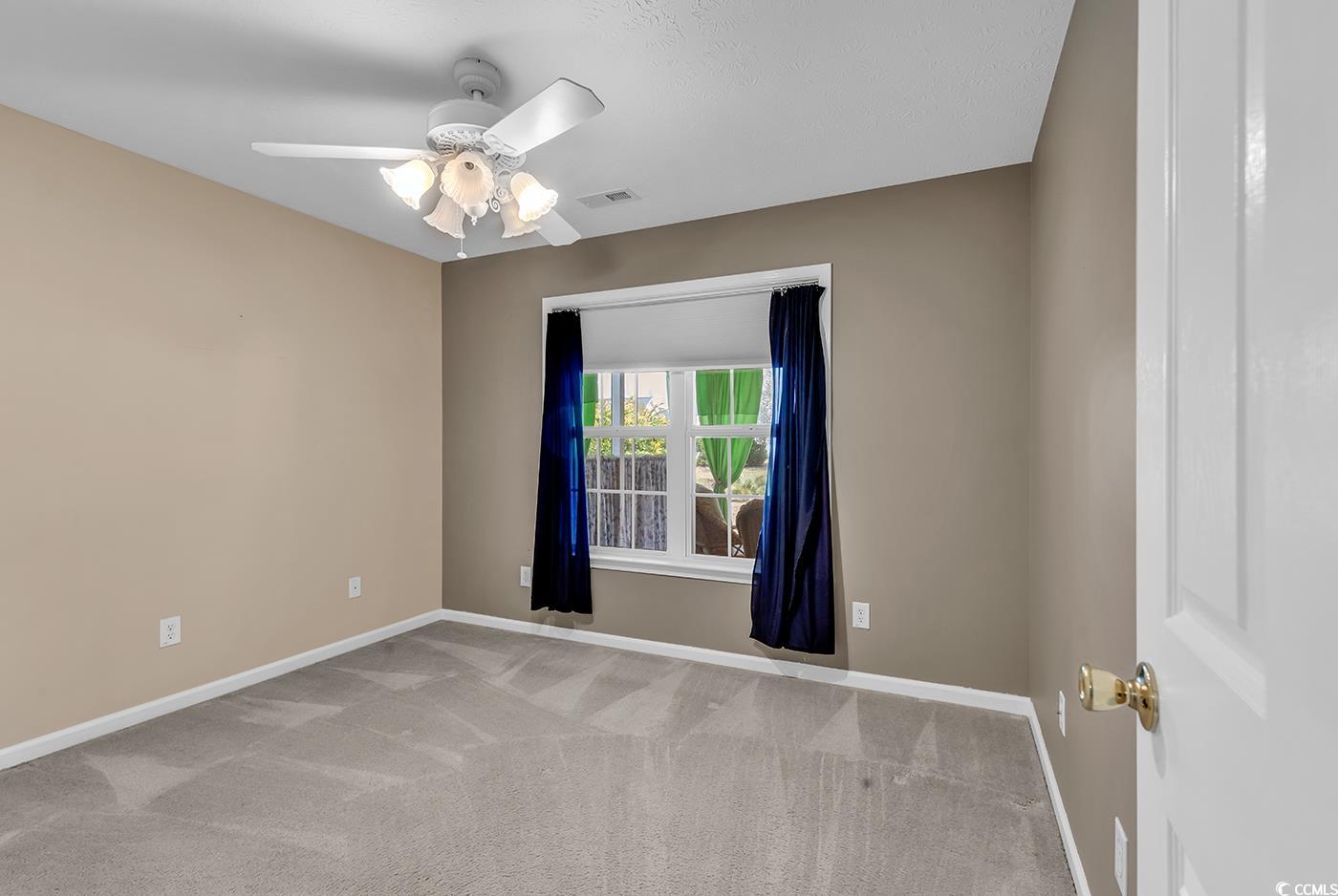1336 Gailard Drive Conway, SC 29526 - Photo 22 of 39 Carpeted spare room with a ceiling fan, baseboards