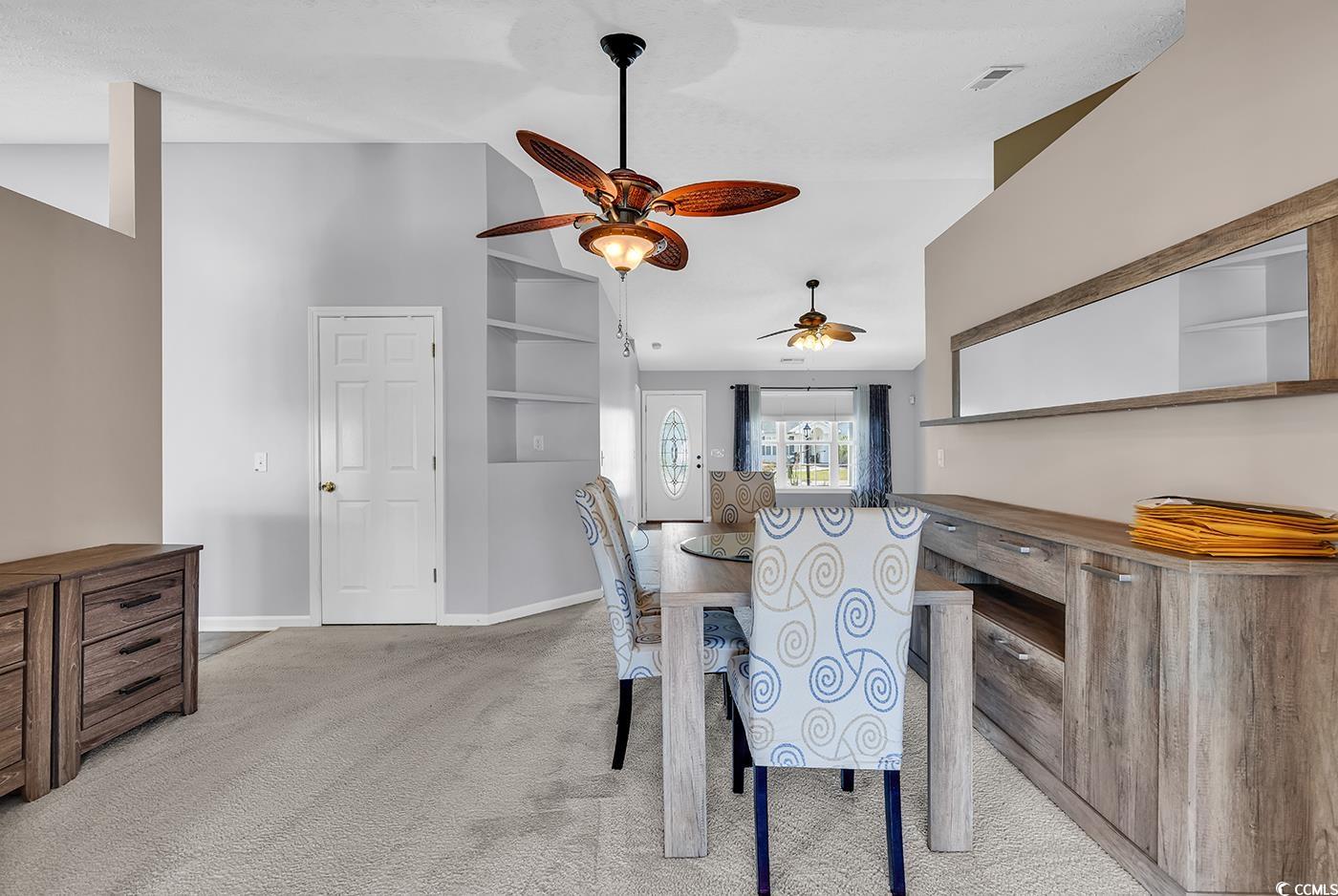 1336 Gailard Drive Conway, SC 29526 - Photo 9 of 39 Carpeted dining area featuring vaulted ceiling, ba
