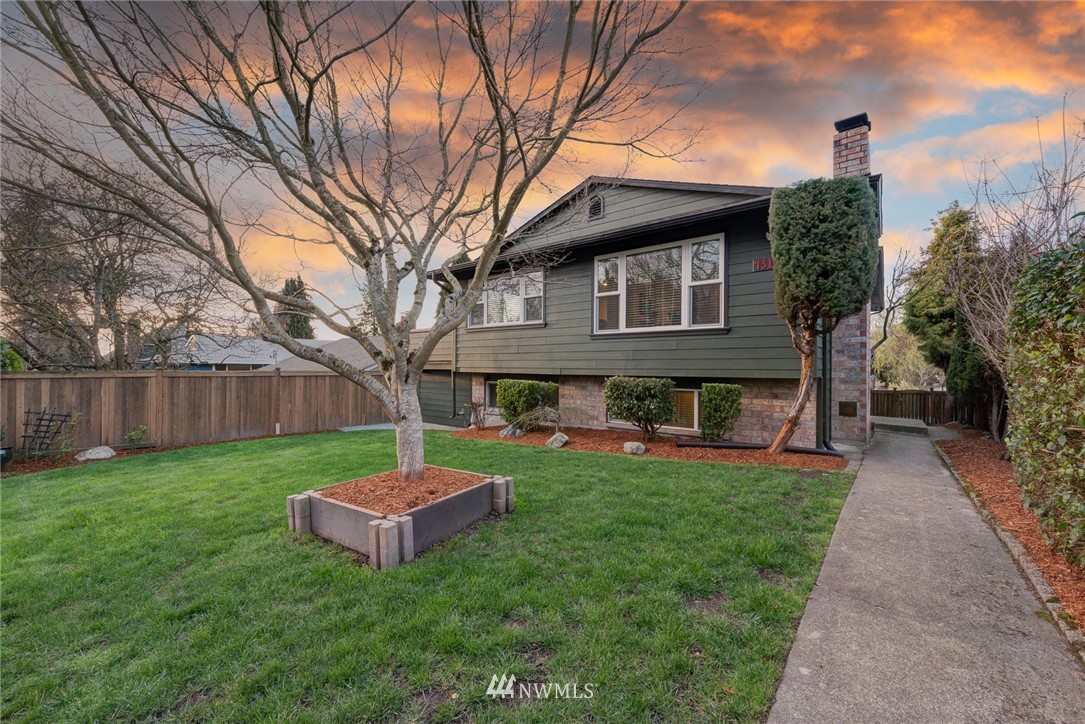 4314 Southwest Frontenac Street Seattle, WA 98136 - Photo 1 of 32 a front view of a house with a yard and trees