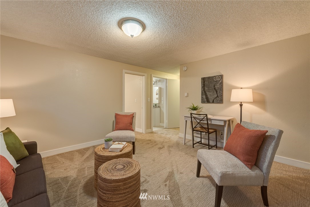 4314 Southwest Frontenac Street Seattle, WA 98136 - Photo 21 of 32 a dining room with furniture and wooden floor