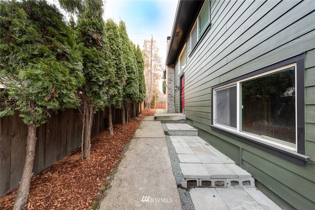 4314 Southwest Frontenac Street Seattle, WA 98136 - Photo 26 of 32 a view of a pathway with a backyard