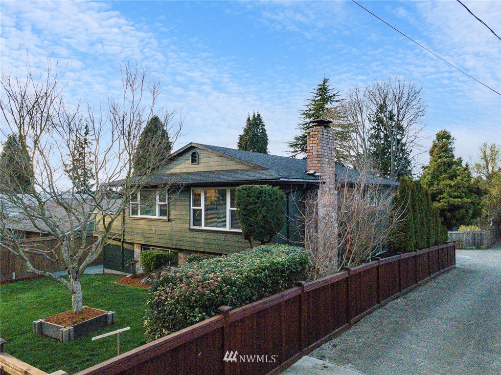 4314 Southwest Frontenac Street Seattle, WA 98136 - Photo 32 of 32 a front view of a house with a yard