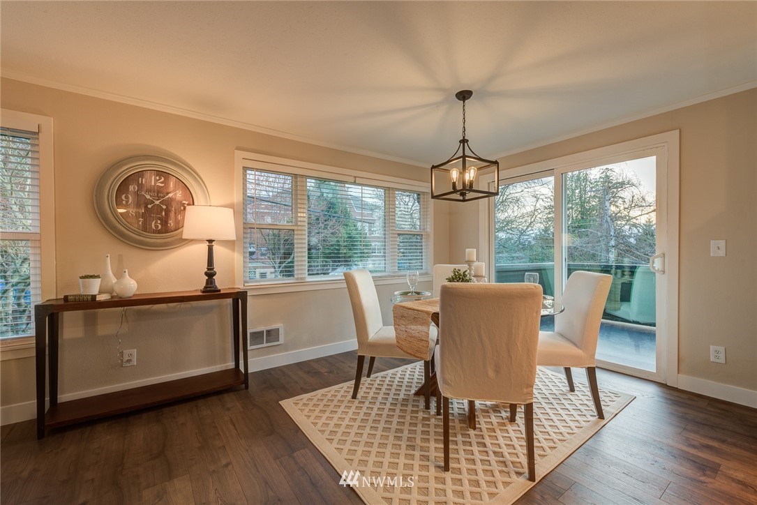 4314 Southwest Frontenac Street Seattle, WA 98136 - Photo 9 of 32 a dining room with furniture window wooden floor