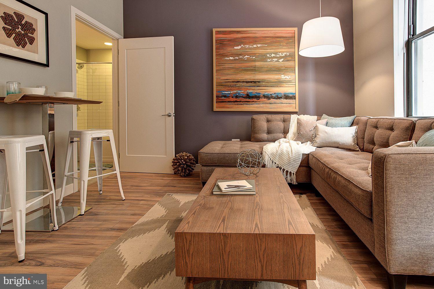 42 South 15th Street, Unit 0B0810 Philadelphia, PA 19102 - Photo 16 of 36 a living room with furniture and a window