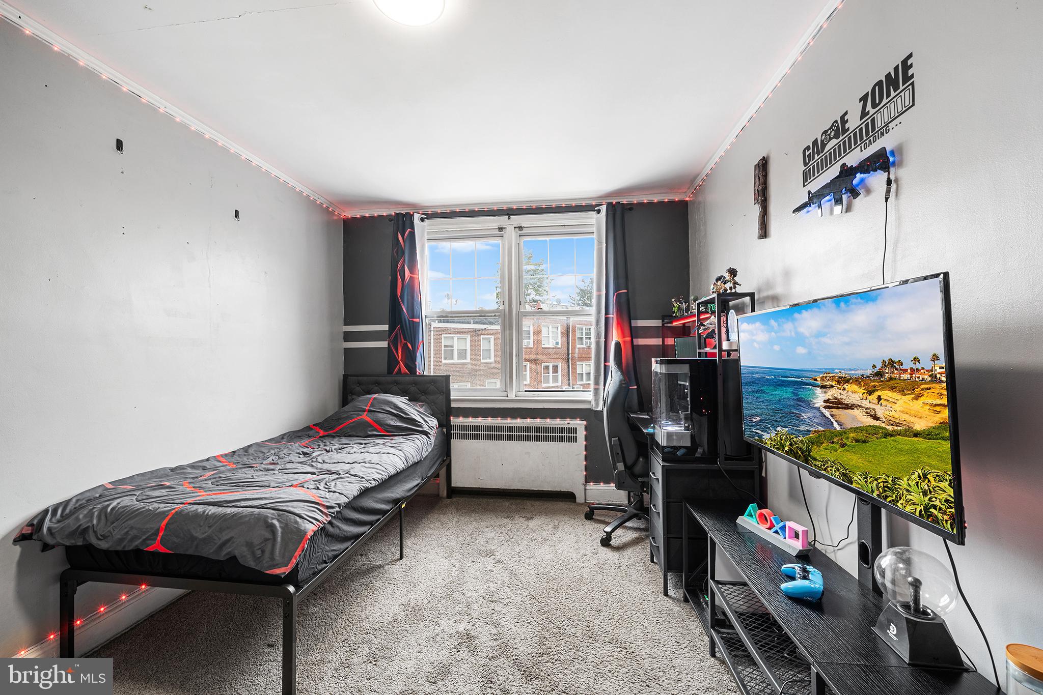 223 St Laurence Road Upper Darby, PA 19082 - Photo 18 of 32 a bedroom with bed and a flat tv screen on the dresser