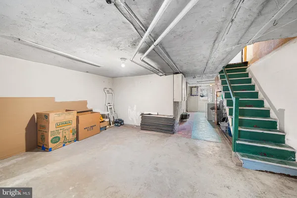 a view of a garage with stairs